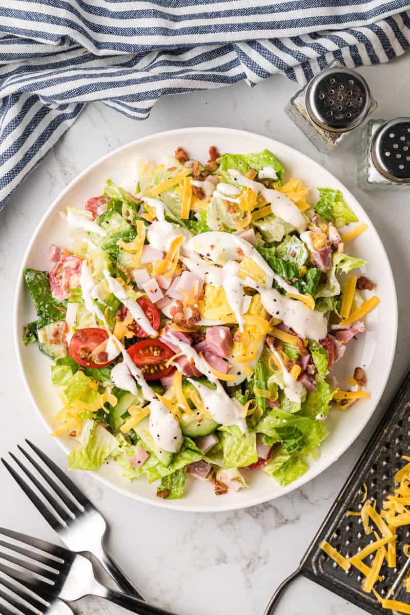 single serving of the Chef Salad on a white plate.