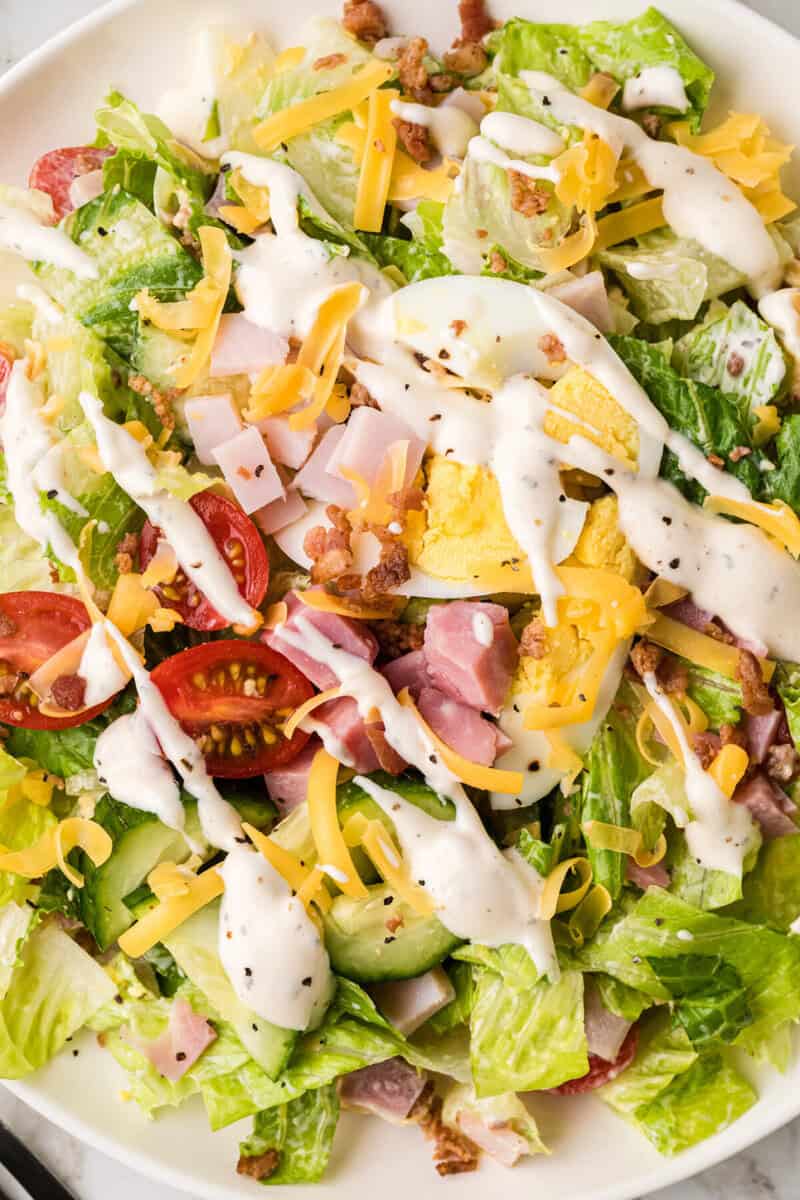 closeup of the Chef salad on a white plate.