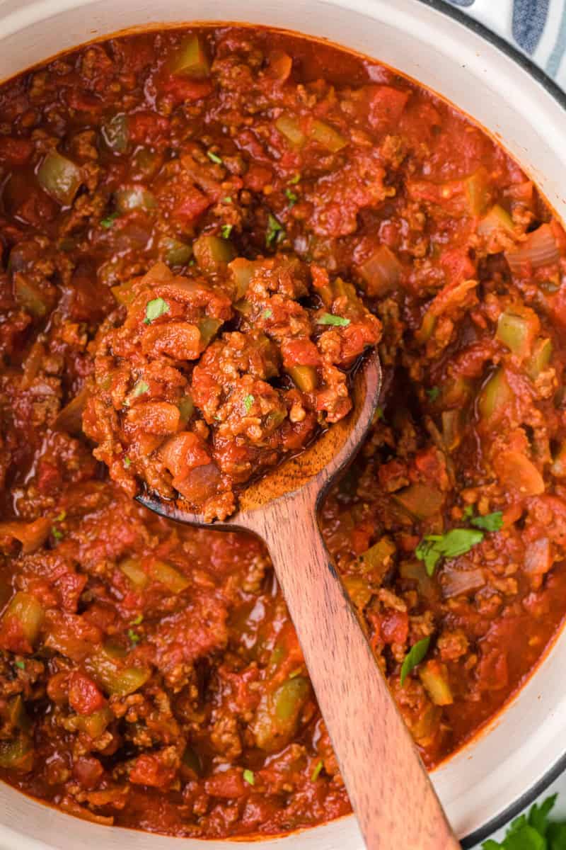 closeup of the No Bean Chili being served with a wooden ladle.