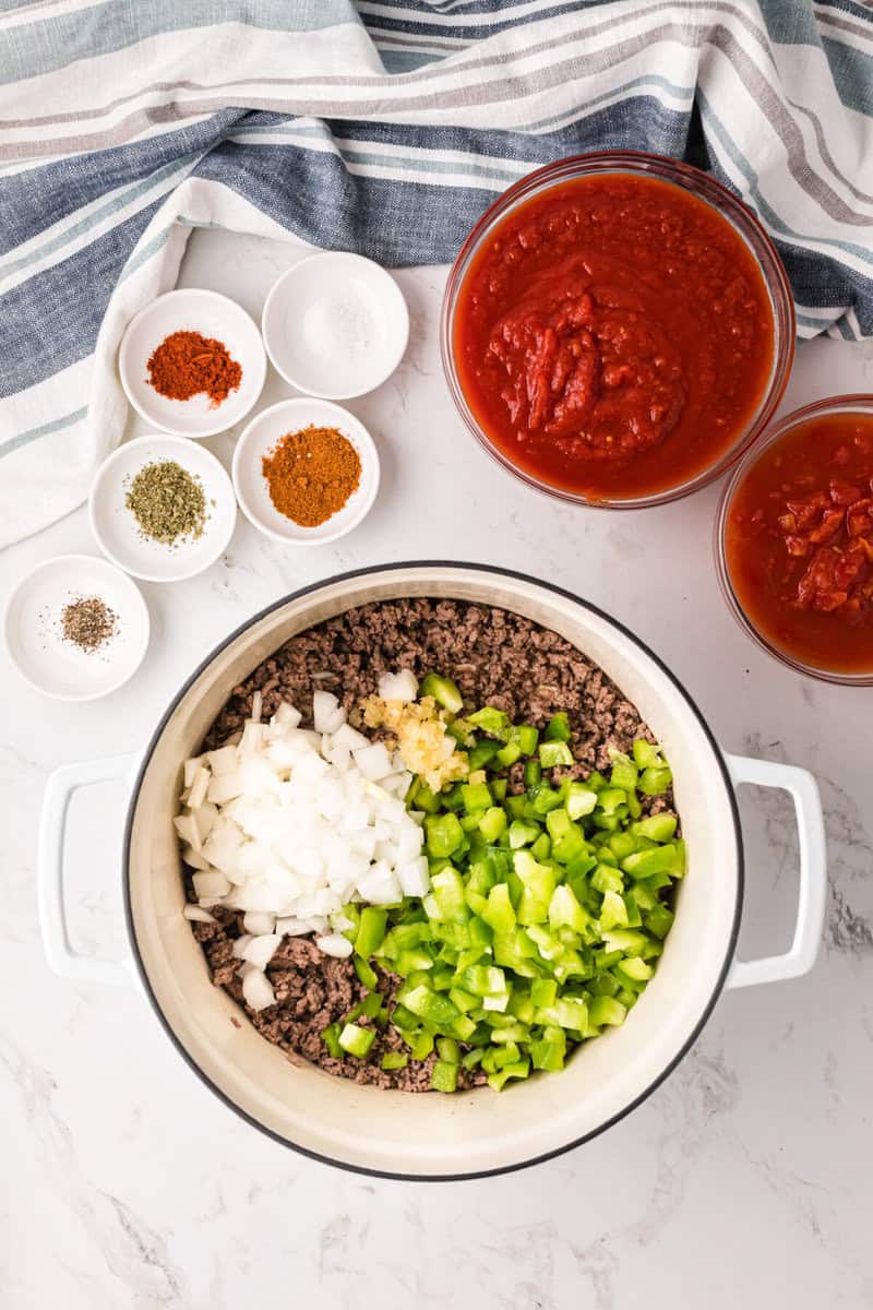 ground beef, peppers, onions, and garlic in large pot to cook.