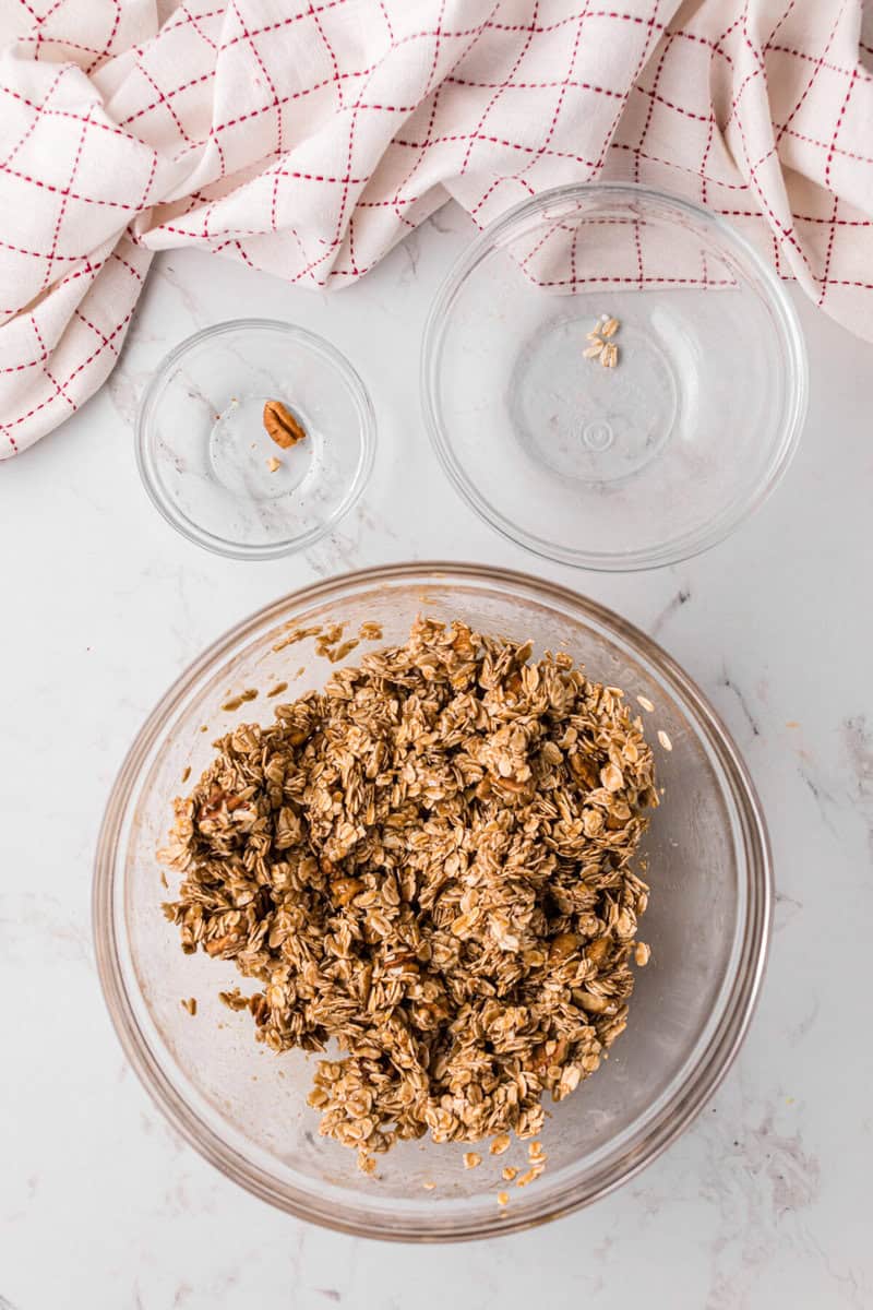 adding the granola to the honey mixture.