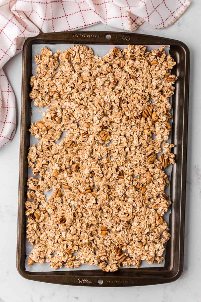uncooked granola on baking sheet.