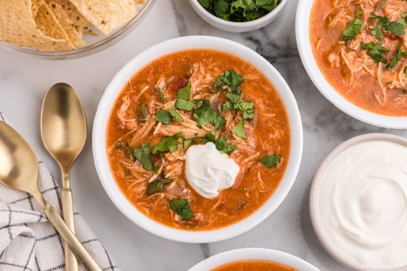 top-down view of the Chicken Fajita Soup in white bowls.