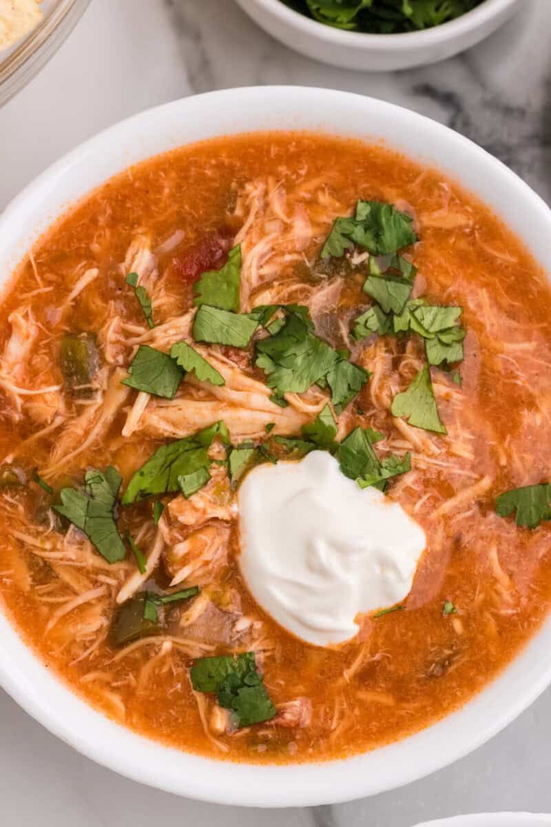 closeup of the chicken fajita soup in a white bowl.