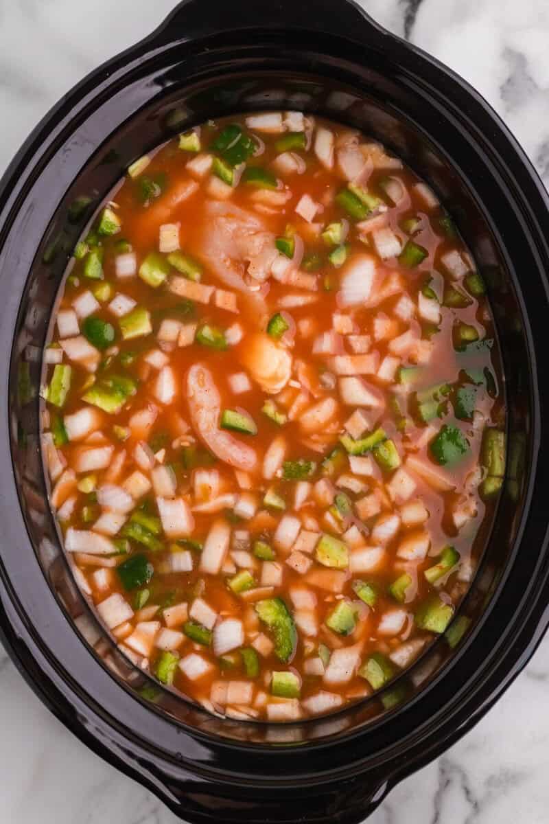 all ingredients for the slow cooker chicken fajita soup in the slow cooker.