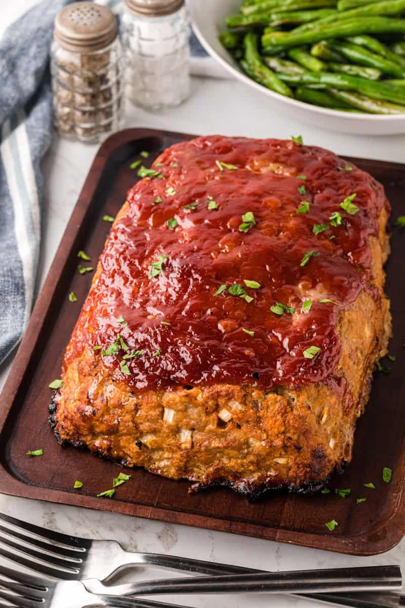 closeup of the baked meatloaf on the baking sheet.