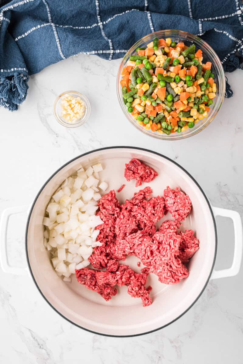 ground beef and onions in a pot to be cooked before making the rest of the soup.