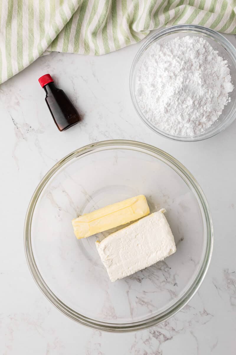 mixing the cream cheese and butter together to make the icing.