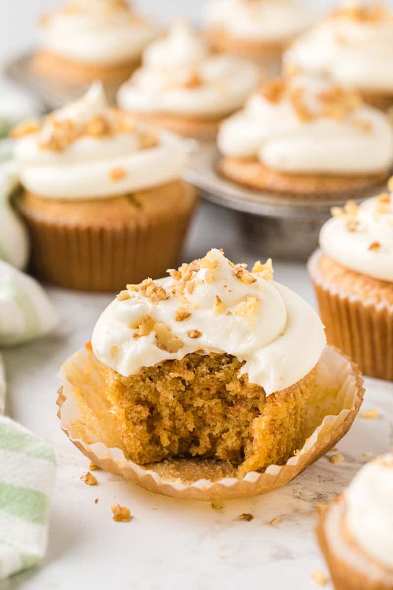 closeup of a cupcake with a bite taken out of it.