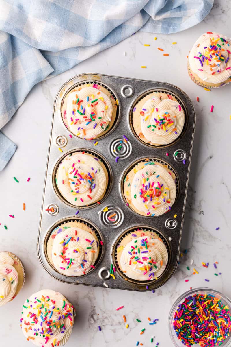 top-down view of the finished Funfetti Cupcakes in the baking pan.