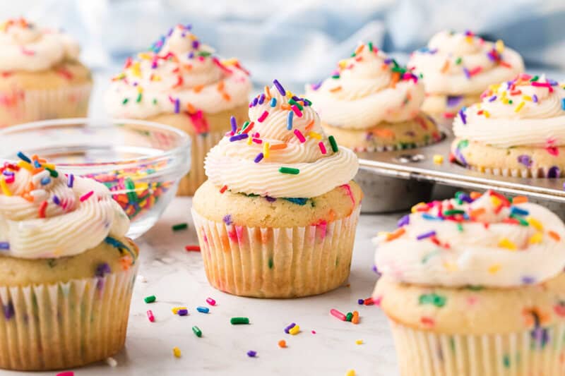 Funfetti Cupcakes on counter and in the cupcake pan.