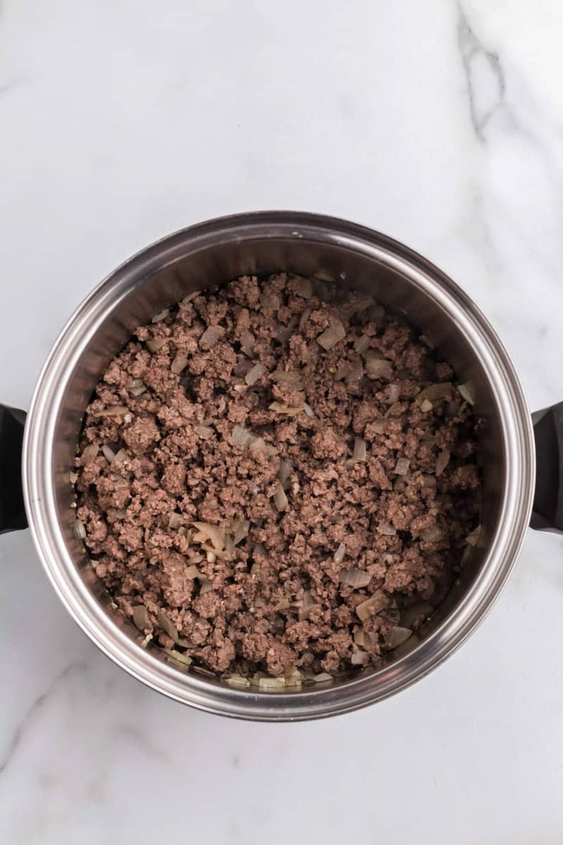 cooked ground beef in the soup pot.