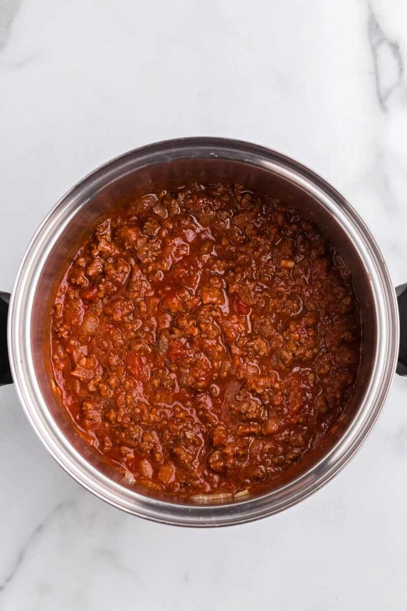 top-down view of the soup in the pot cooking.