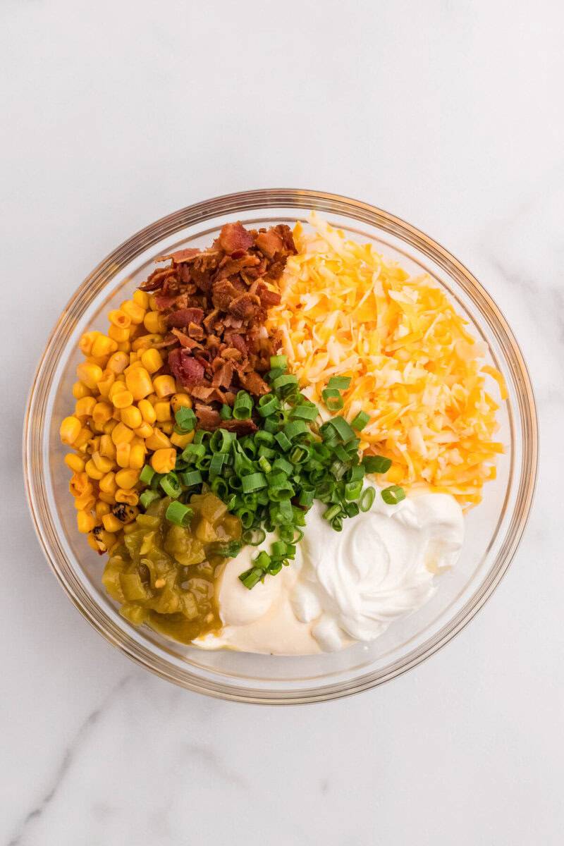 ingredients for the Crack Corn Dip in a large mixing bowl.