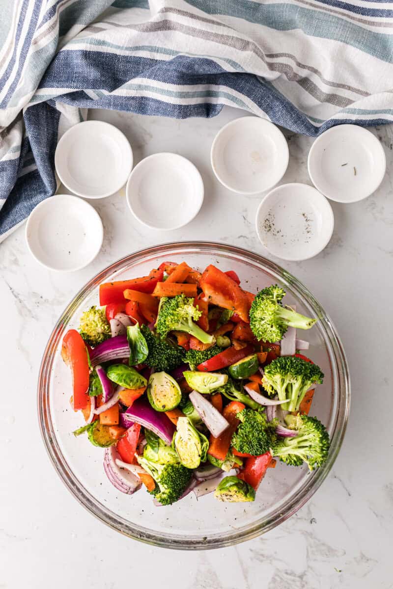 vegetables seasoned in large mixing bowl.