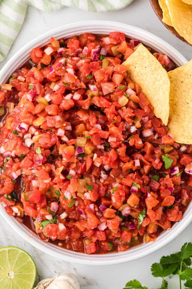 top-down view of the homemade salsa in a white serving bowl.