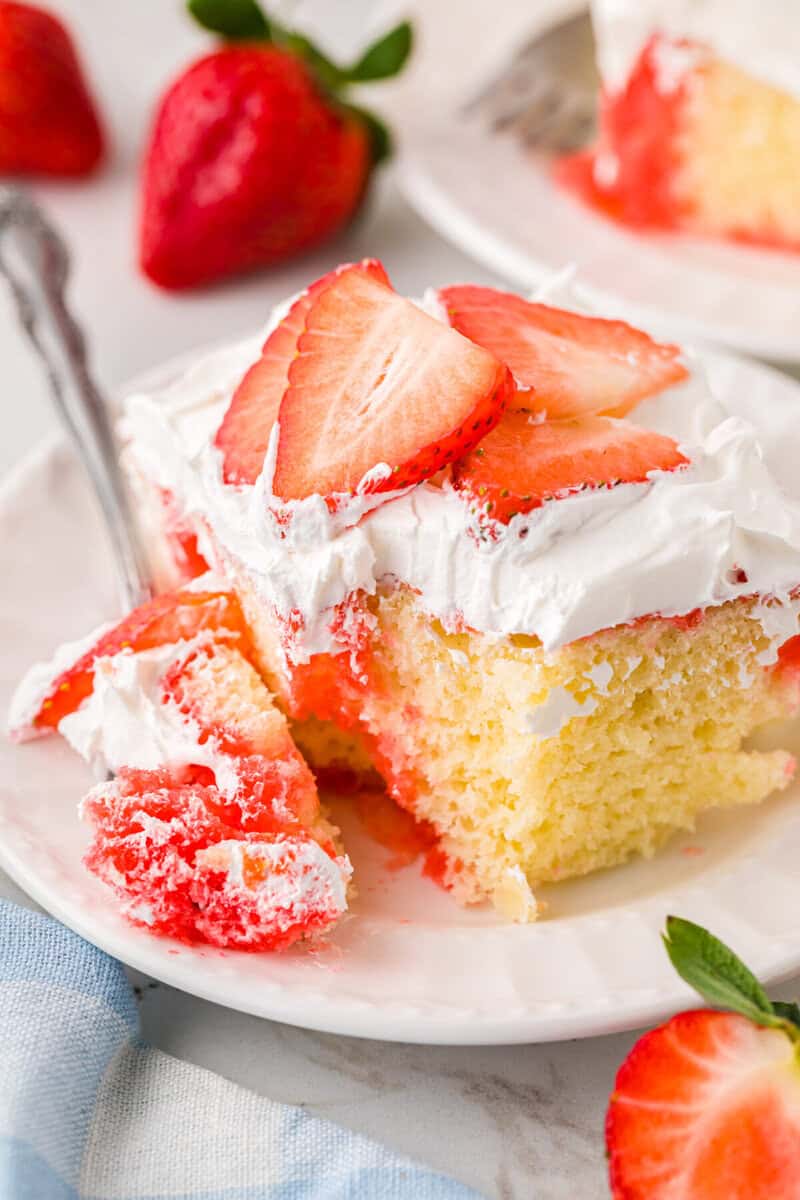 closeup of a slice of the Strawberry Poke Cake.