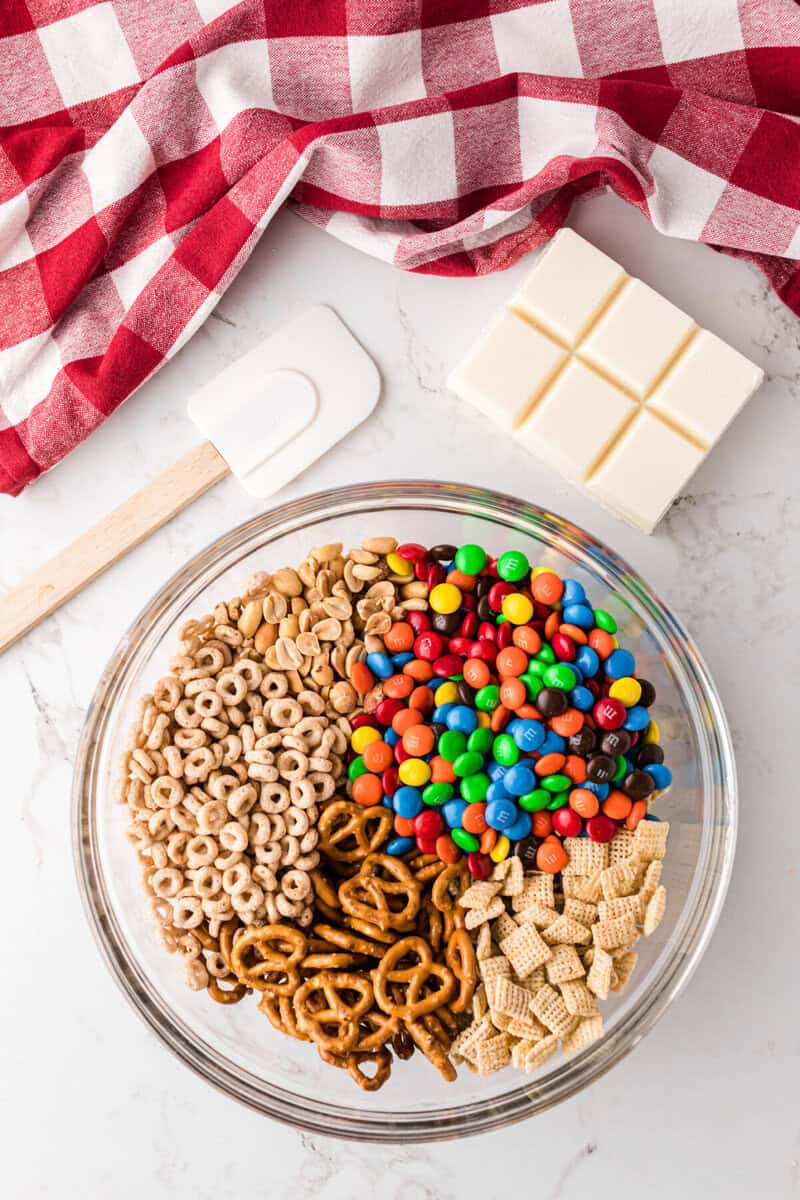 all ingredients for the snack in a large mixing bowl.