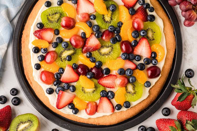 closeup of the fruit pizza on the baking pan.