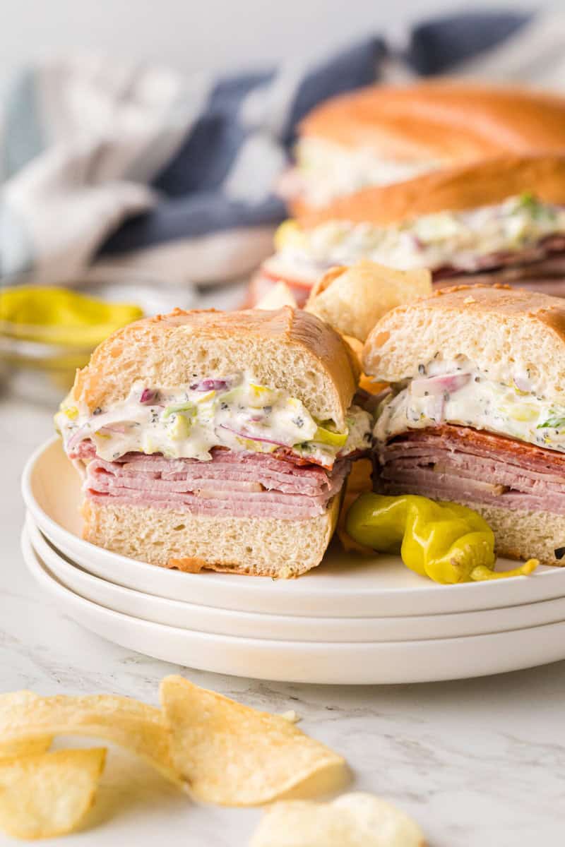 closeup of the grinder sandwich cut in half on a plate.