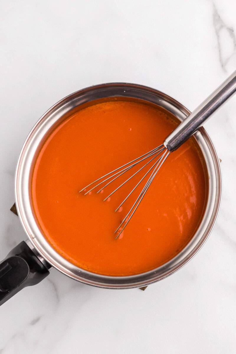 making the buffalo sauce in a pan.