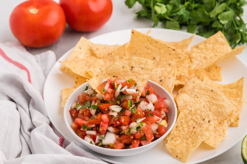 bowl of Pico de Gallo served with tortilla chips.