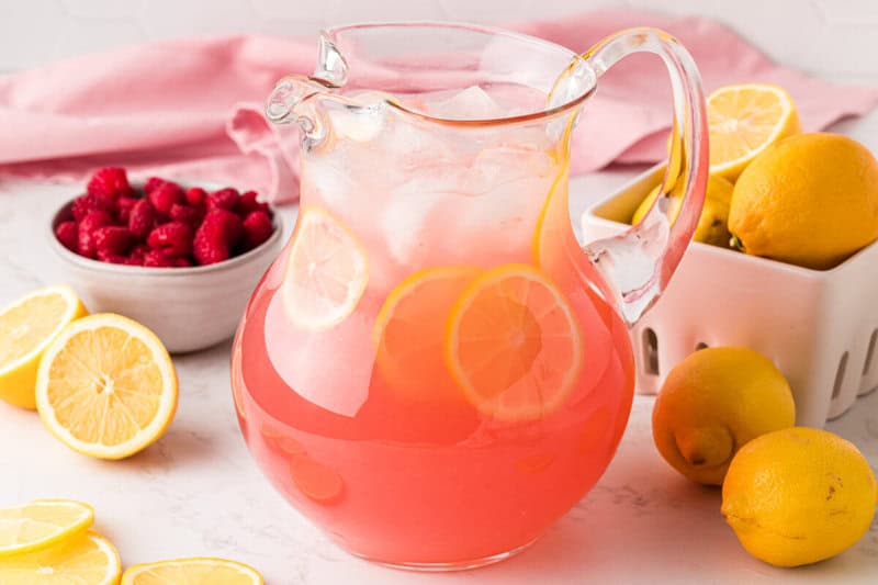 pink lemonade in a glass pitcher.