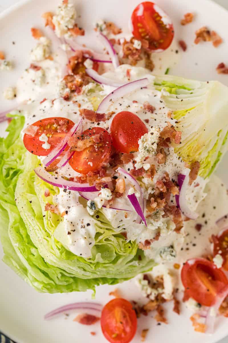 closeup of the Wedge Salad served on a white plate.