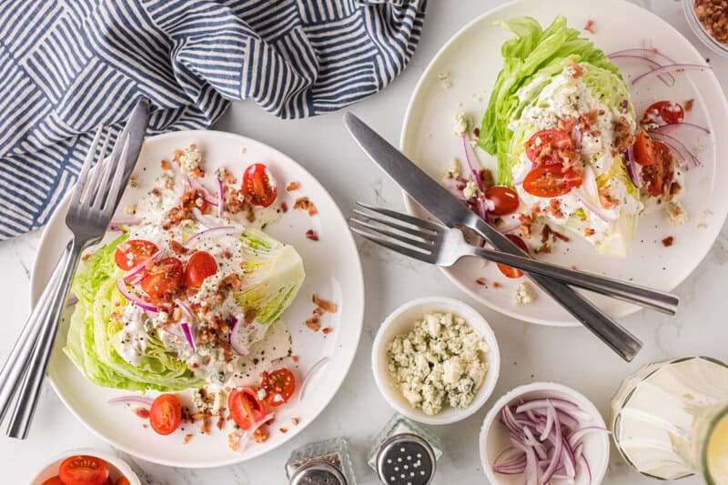 top-down view of two plates of the Wedge Salad.
