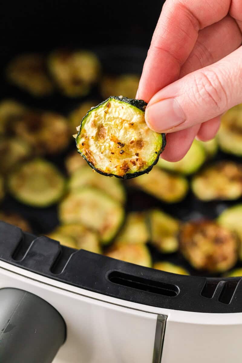 closeup of the Air Fryer Zucchini in hand.
