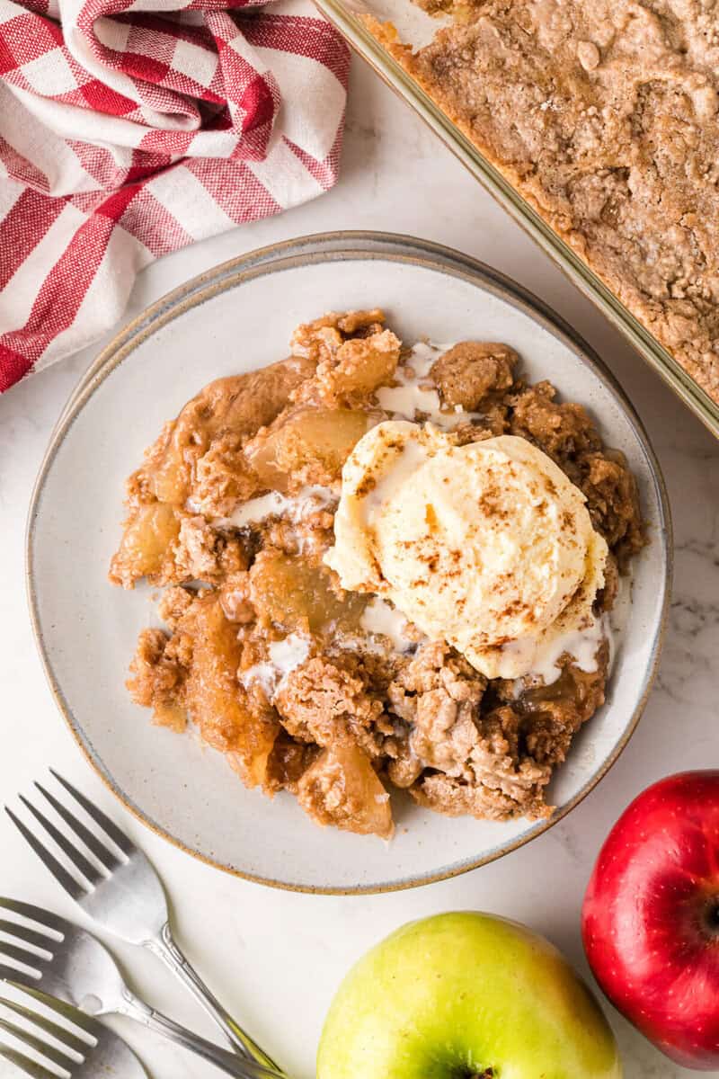 top-down view of the Apple Spice Dump Cake served on a white plate.