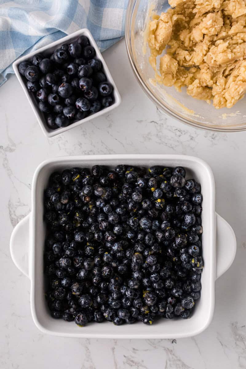 blueberry cobbler filling in the baking dish.
