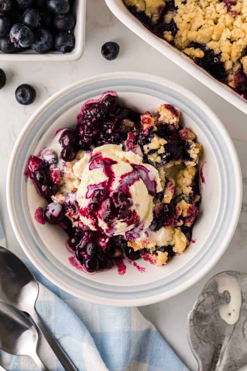 blueberry cobbler served with ice cream.