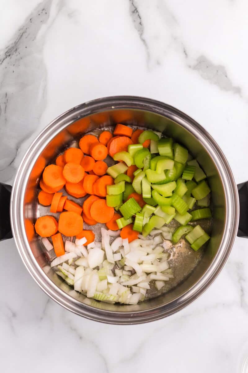 vegetables in the bottom of the large pot.