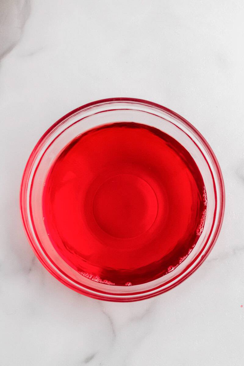 Jell-O that is slightly firm in clear bowl.