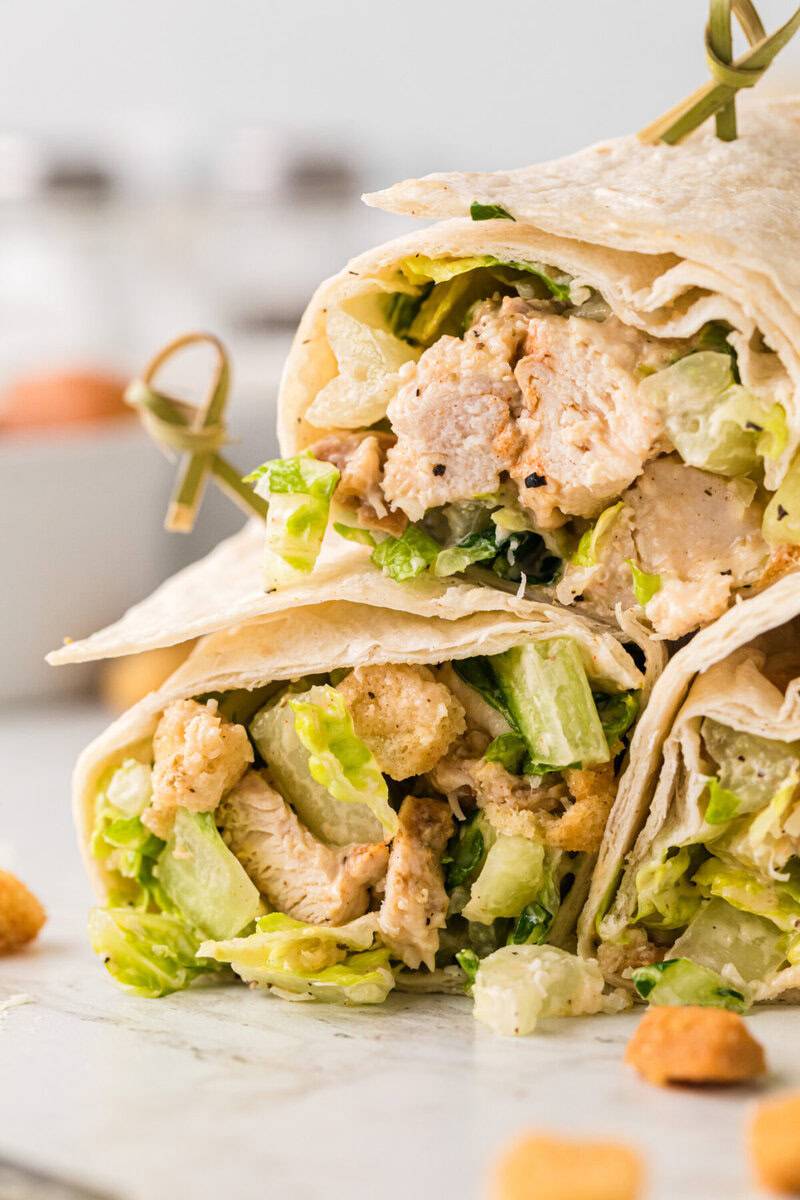 closeup of Chicken Ceasar Wraps stacked on top of each other.
