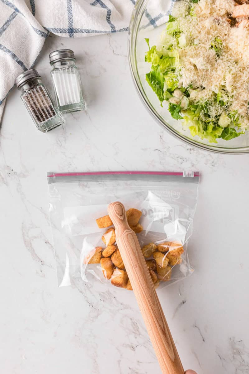 crushing the croutons in a Ziplock bag.