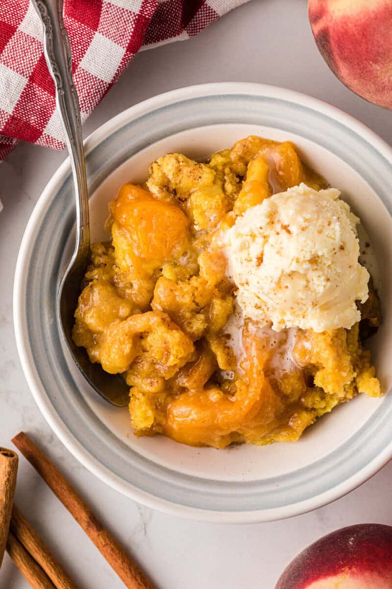 top-down view of the Peach Dump Cake in a white bowl.