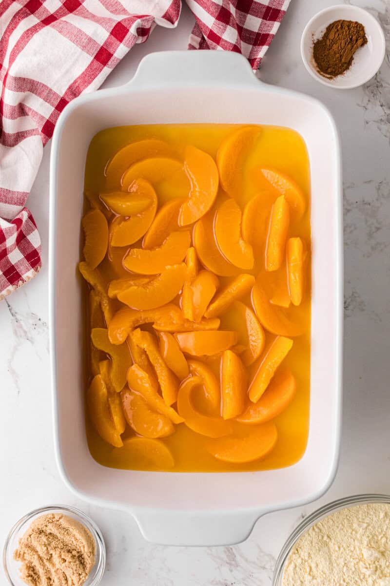 peaches on the bottom of the baking dish.