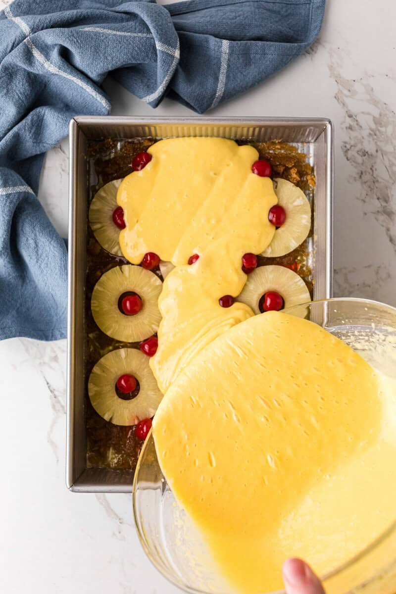 pouring the batter into the baking pan.