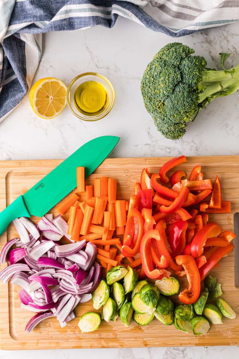 slicing the vegetables to get them ready to roast. 