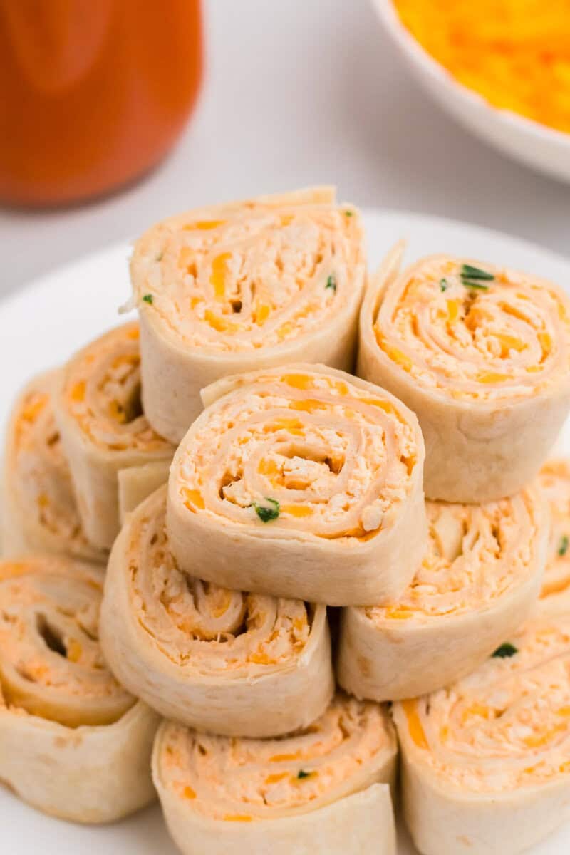 Buffalo Chicken Pinwheels stacked on top of each other.
