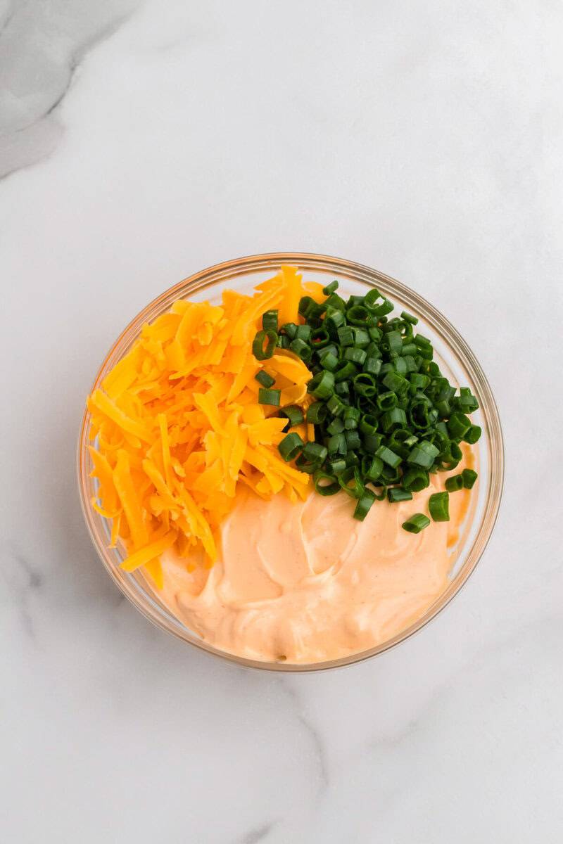 adding the additional ingredients to the buffalo mixture.