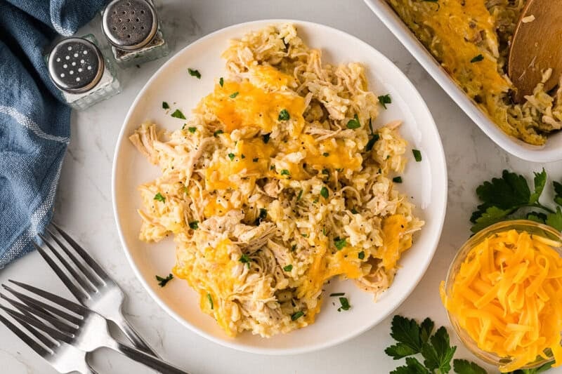 single serving of creamy chicken and rice casserole on a white plate with a view from the top down