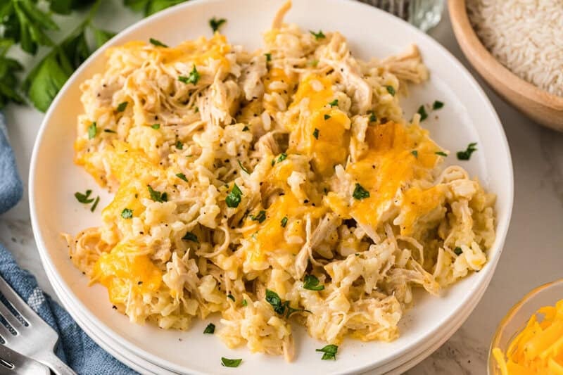 creamy chicken and rice casserole served on white plates