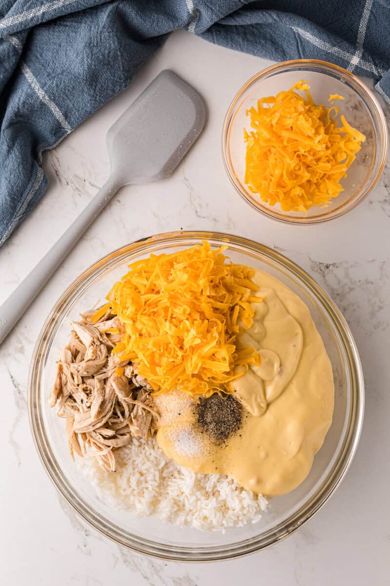 casserole ingredients in a large glass bowl to be mixed together.