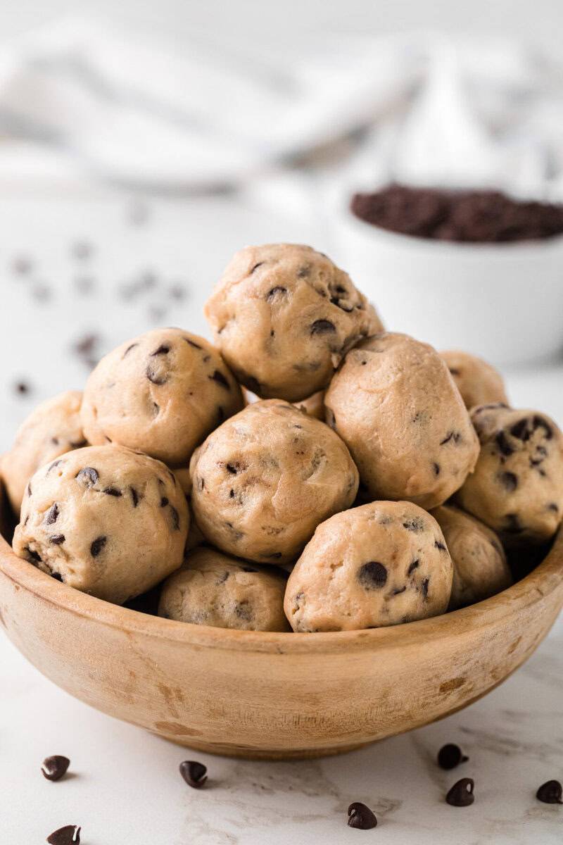 closeup view of the Cookie Dough Bites in a wooden bowl.