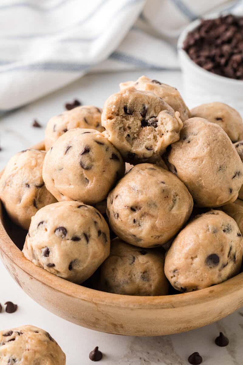 closeup of the Cookie Dough Bites in a wooden bowl.