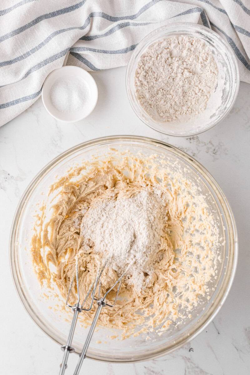 mixing the flour with the sugars.