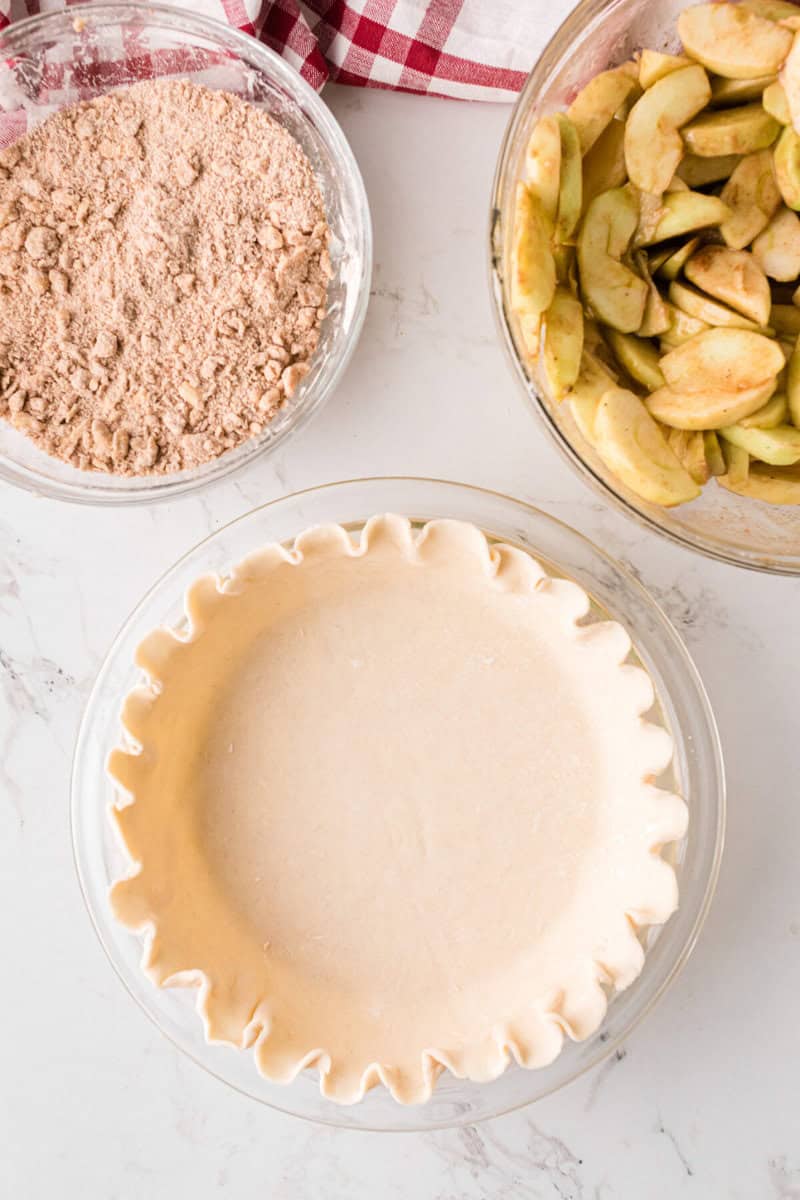 pie crust in the bottom of a pie pan.